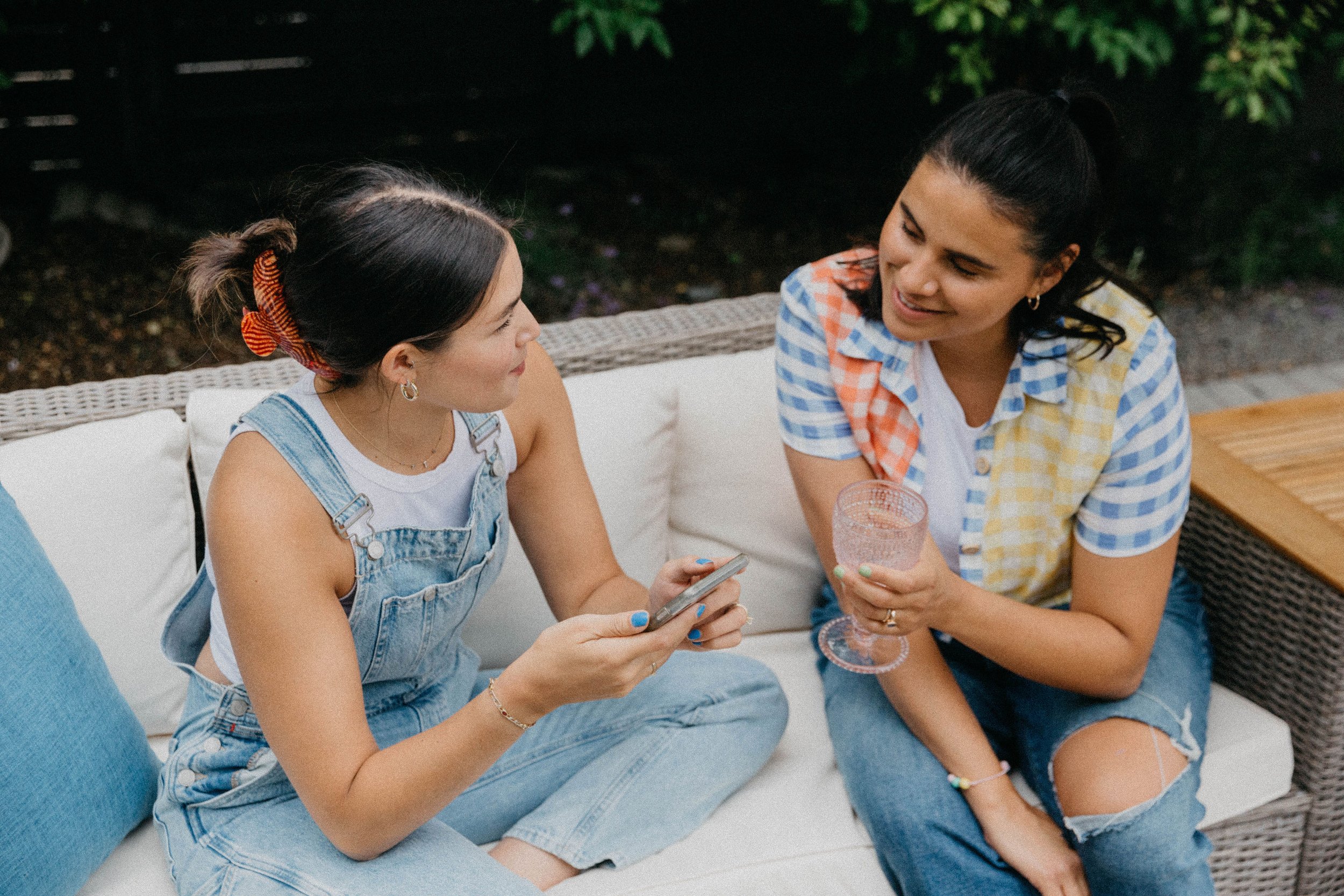 Two friends connecting over a conversation outdoors